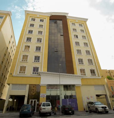 Tall apartment building in a city